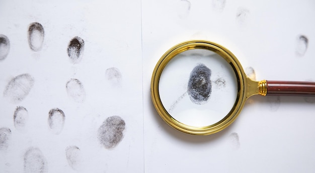 Magnifying glass and fingerprints Detective Investigation