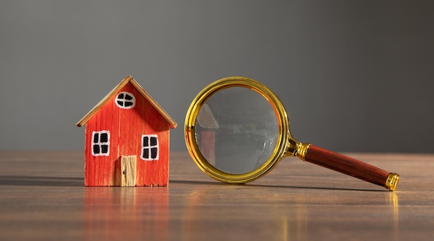 Magnifying glass with a house model Real estate Inspection