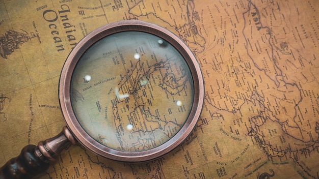 Magnifying glass on world map