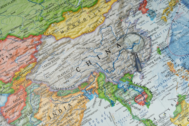 Magnifying glass on Wuhan, China in a Worldwide map