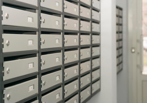 Mailboxes filled with numbers In an apartment building 3