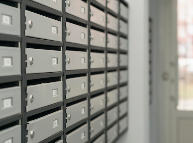 Mailboxes filled with numbers In an apartment building