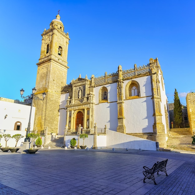 Main square with medieval stone church in the picturesque town of Medina Sidonia Cadiz