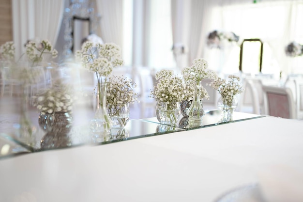 Main table at a wedding reception with beautiful fresh flowers