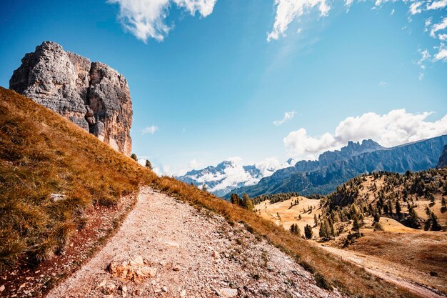 Majestic landscape of Alpine red autumn Cinque Torri Passo Falzarego Tofana Wonderful hiking nature scenery in dolomite italy near Cortina d'Ampezzo