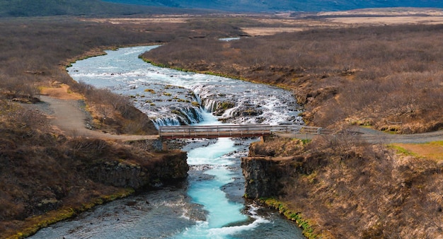 Photo majestic summer aerial view of bruarfoss waterfall the icelands bluest waterfall