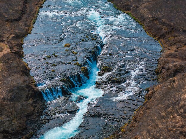 Photo majestic summer aerial view of bruarfoss waterfall the icelands bluest waterfall