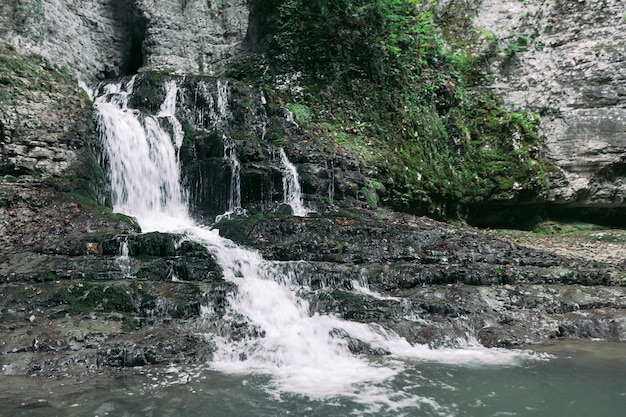 Majestic waterfall in the forest. Mountain river waterfall view. Martvili canyon in Georgia.