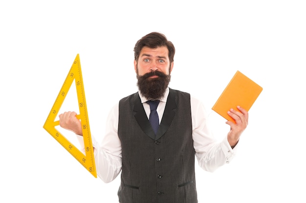 Make geometry interesting. School teacher hold book and triangle. Private teaching. Bearded man prepare technical teaching aids for lesson. Geometry teaching. Teaching and education.