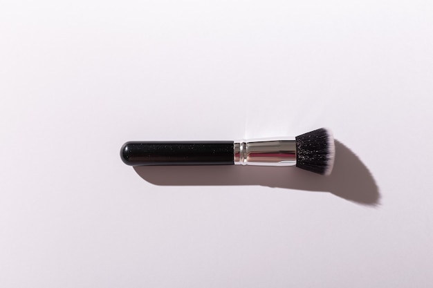 Make up brush on white background top view