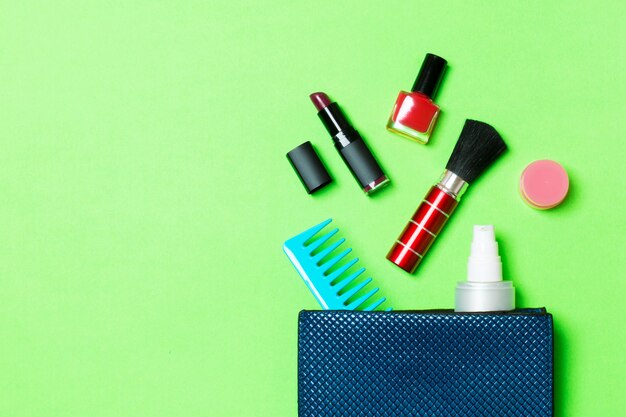 Make up products spilling out of cosmetics bag