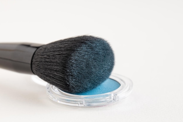 Makeup brush with blue eyeshadows