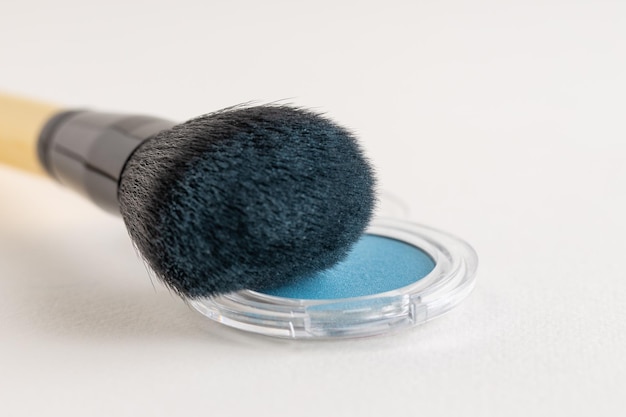 Makeup brush with blue eyeshadows