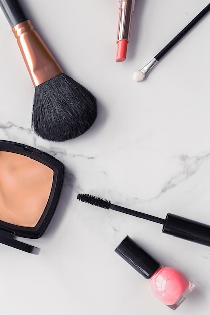 Makeup and cosmetics flatlay on marble