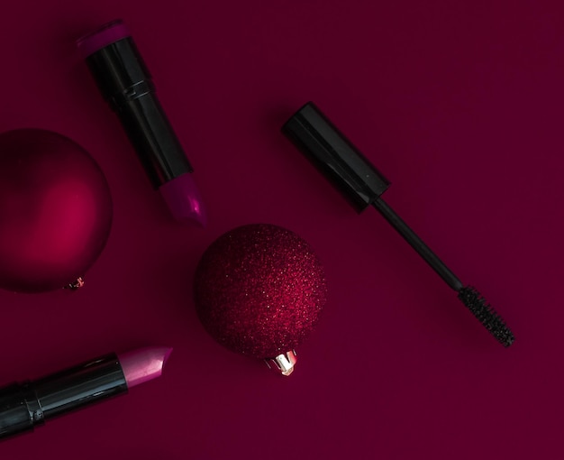 Makeup and cosmetics product set for beauty brand Christmas sale promotion luxury burgundy flatlay background as holiday design