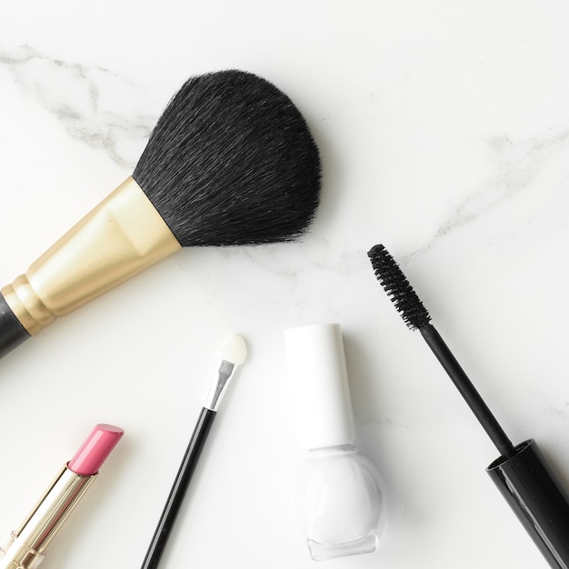 Makeup and cosmetics products on marble flatlay background  modern feminine lifestyle beauty blog an...