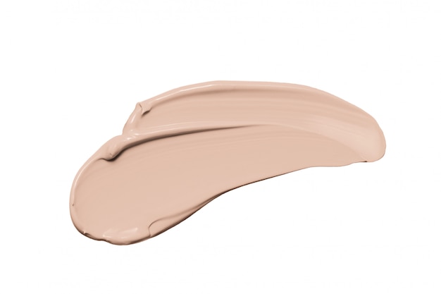 Makeup foundation, beige concealer smudge isolated on white