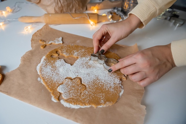 Making Christmas gingerbread cookies from dough