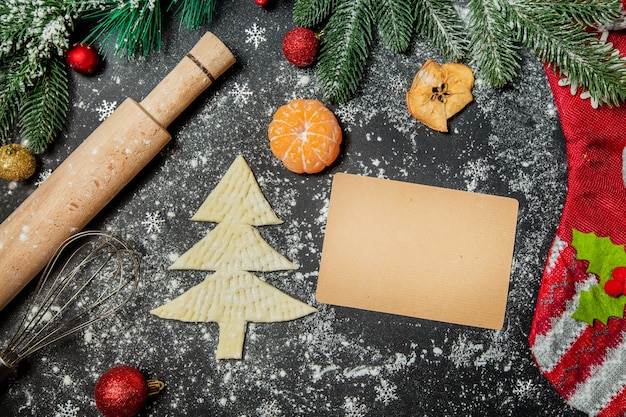 making cookies in the form of a Christmas tree puff pastry with Christmas decorations