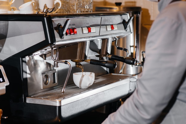 Making delicious coffee in a modern coffee shop close-up