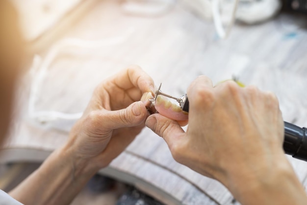 making a denture in the hands of an orthodontist