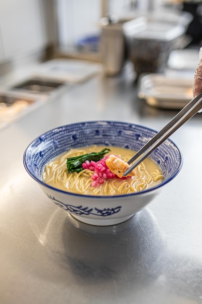 Making japanese ramen noodle soup with shrimp