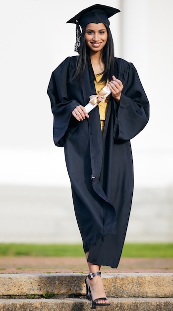 Making my way to even greater achievements Portrait of a young woman holding her diploma on graduation day