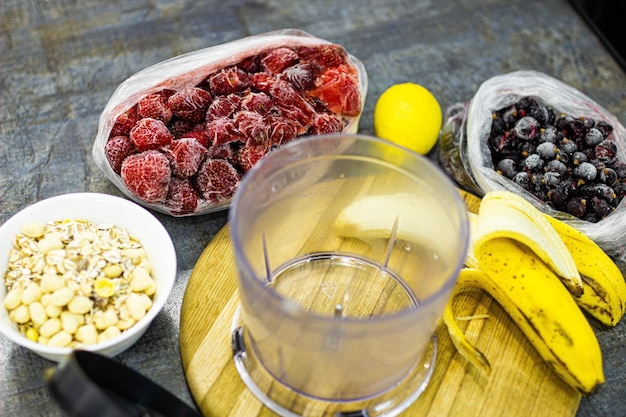 making smoothies in a blender from frozen berries