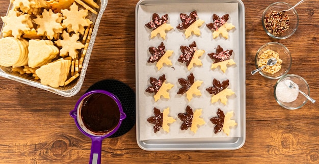 Making starshaped cookies with chocolate and peppermint chips