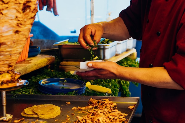 Making tacos al pastor, typical Mexican food.