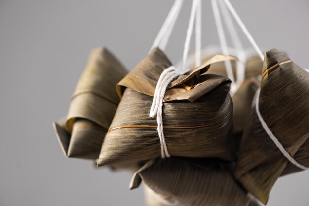 Making zongzi food wrapping Chinese rice dumpling