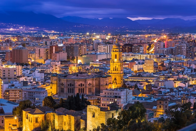 Malaga cathedral and cityscape at twilight