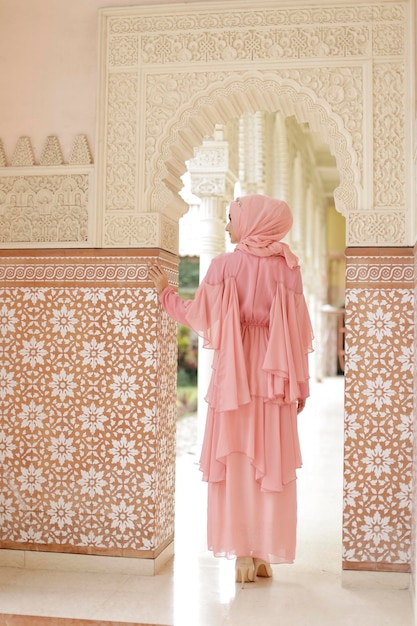 Malay or indonesia wedding dress beauty or eidul fitri concept A muslim woman posing at the mosque