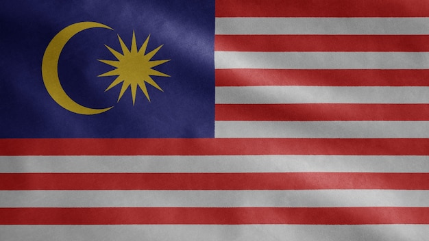 Malaysian flag waving in the wind. Malaysia banner blowing, soft and smooth silk.