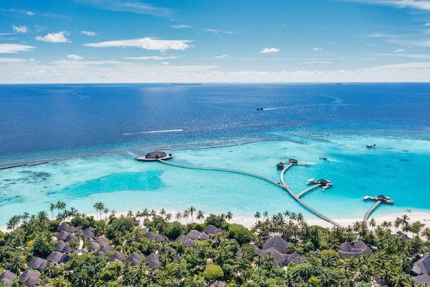 Maldives paradise island. Tropical aerial landscape, ocean bay water bungalows villas, exotic shore