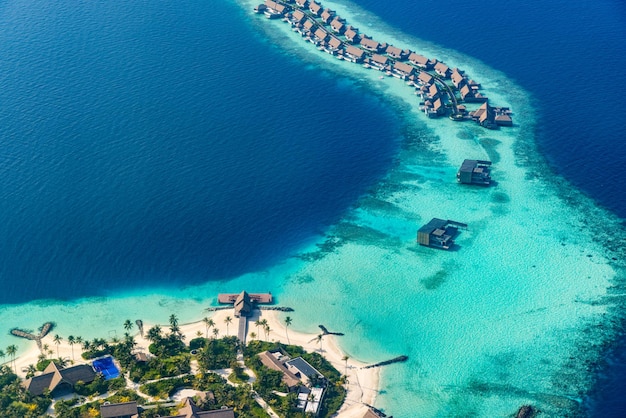 Maldives paradise island Tropical aerial landscape seascape with jetty water bungalows villas