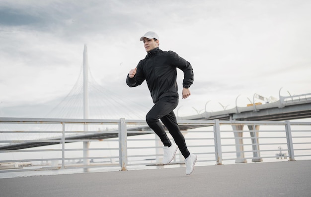 Male athlete runner training to run fast on the street in sportswear