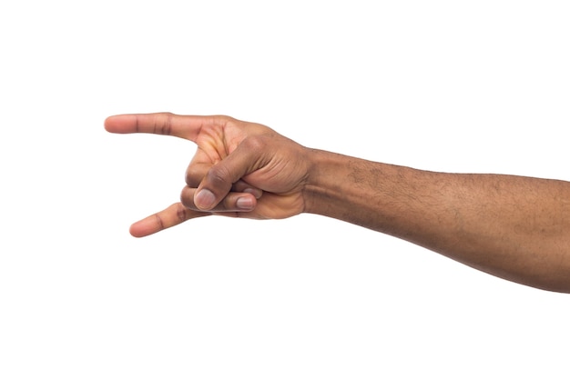 Male black hand making rock'n'roll gesture, close up, isolated on white backgroung