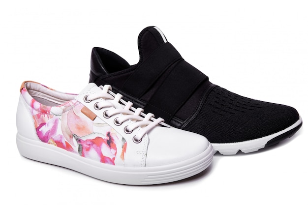 Male black and ladies white sport shoes