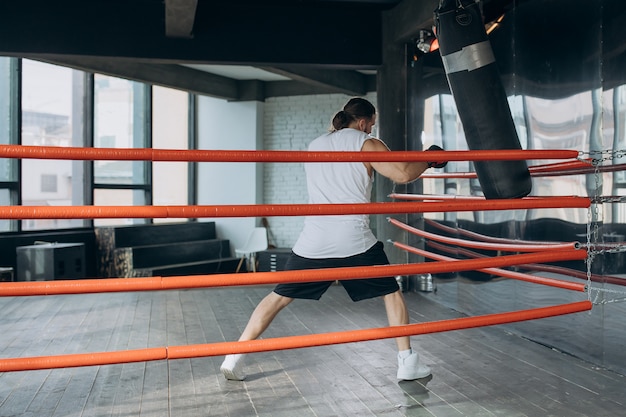 Male Boxer enters the ring and prepares for the fight