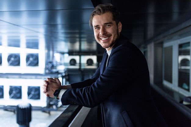 Male businessman working as an engineer on the background of refrigeration ventilation air