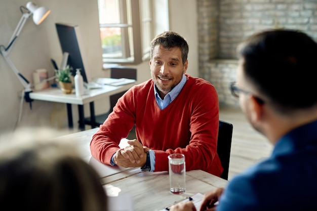 Male candidate talking to human resource team during an job interview in the office