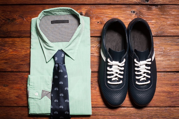 Male casual clothes set. Man shirt tie and sneakers.