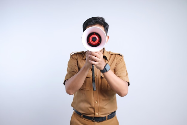 Male Civil Servant Wearing Uniform Announcing Information Using Megaphone on Gray Background