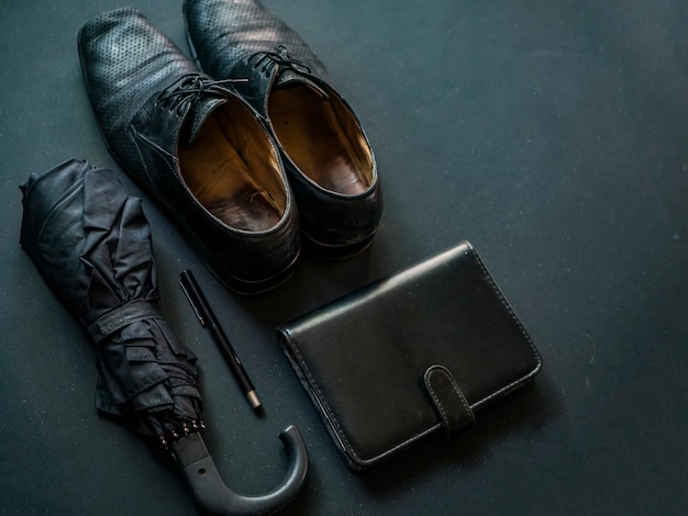 Male classic elegant accessories on dark chalkboard copy space