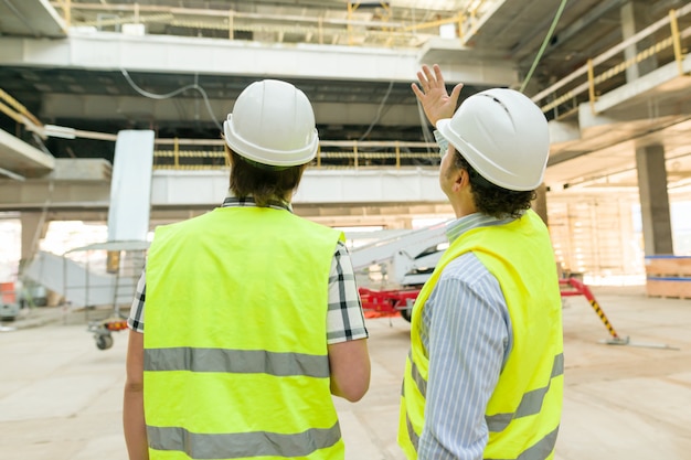 Male construction worker and engineer