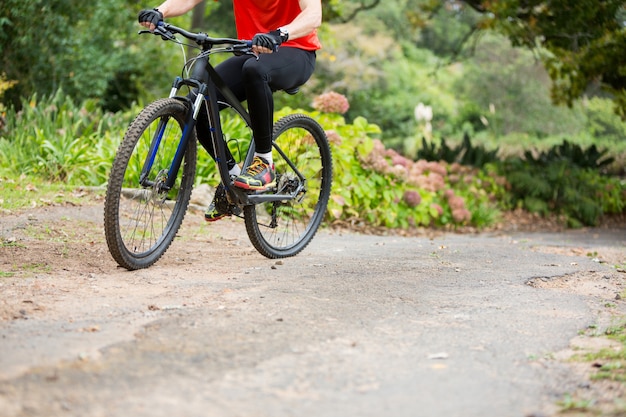 Male cyclist cycling in countryside