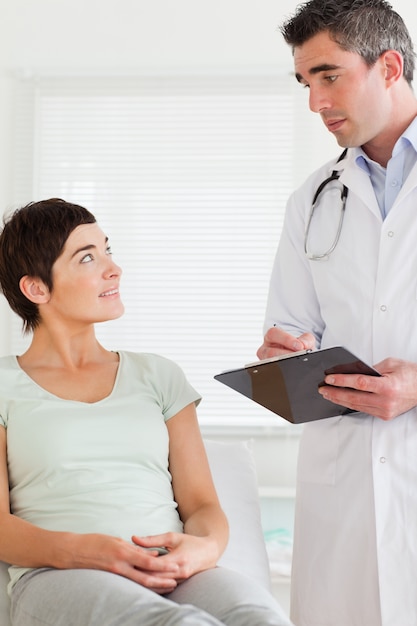 Male Doctor and female patient looking at each other