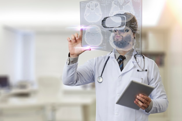 Photo male doctor in his office, using a virtual reality glasses, looking at a virtual screen