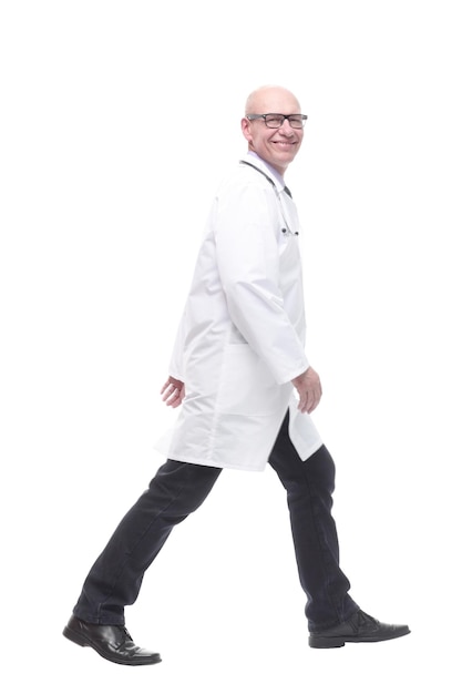 Male doctor with a stethoscope striding forward.